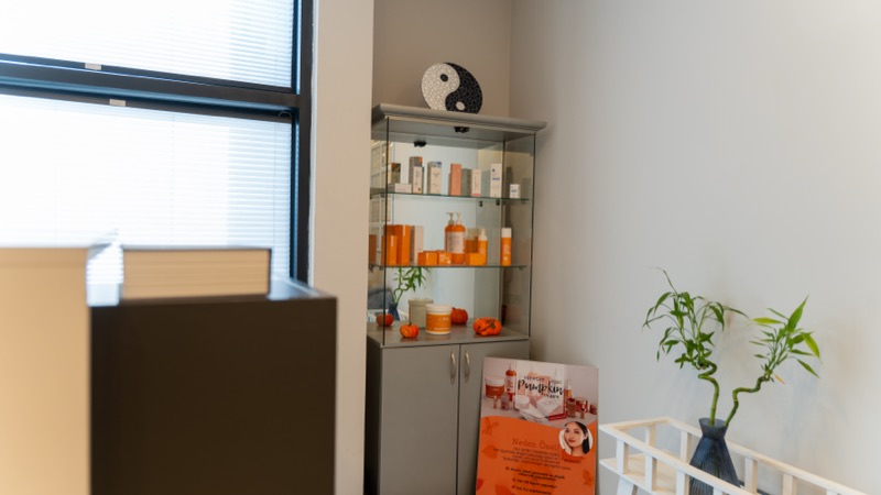 Care product display and decorative plants in the reception area